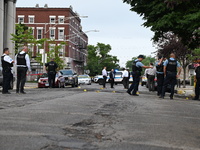 Shell casings are being recovered at the crime scene. A 19-year-old male victim is being shot and killed in Chicago, Illinois, United States...