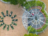 Yoga lovers are practicing yoga on the lotus pond trestle at Tiande Lake Park in Taizhou, China, on June 21, 2024. (