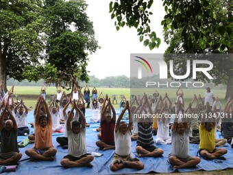 People are performing yoga on International Day of Yoga at the Brigade Parade Ground in Kolkata, India, on June 21, 2024. (