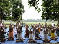 People are performing yoga on International Day of Yoga at the Brigade Parade Ground in Kolkata, India, on June 21, 2024. (