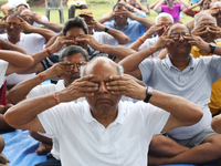 People are performing yoga on International Day of Yoga at the Brigade Parade Ground in Kolkata, India, on June 21, 2024. (