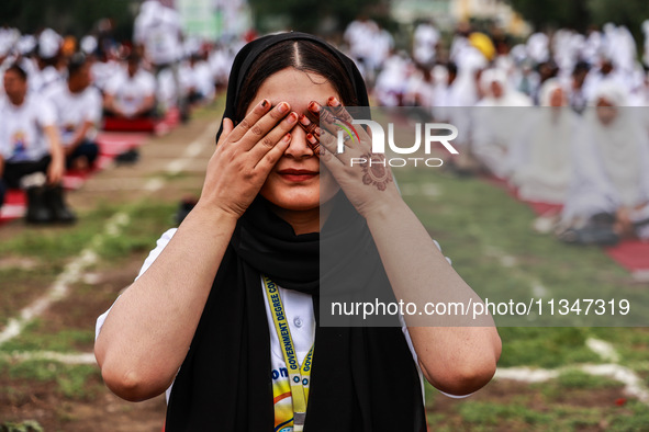 A girl is taking part in the 10th International Yoga Day Celebrations in Baramulla, Jammu and Kashmir, India, on June 21, 2024. Indian Prime...