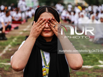 A girl is taking part in the 10th International Yoga Day Celebrations in Baramulla, Jammu and Kashmir, India, on June 21, 2024. Indian Prime...