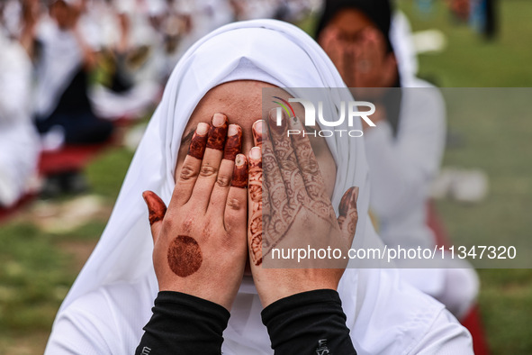 A girl is taking part in the 10th International Yoga Day Celebrations in Baramulla, Jammu and Kashmir, India, on June 21, 2024. Indian Prime...