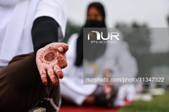 People are taking part in the 10th International Yoga Day Celebrations in Baramulla, Jammu and Kashmir, India, on June 21, 2024. Indian Prim...