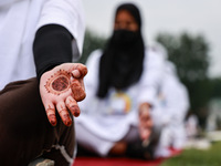 People are taking part in the 10th International Yoga Day Celebrations in Baramulla, Jammu and Kashmir, India, on June 21, 2024. Indian Prim...