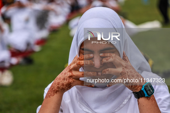 A girl is taking part in the 10th International Yoga Day Celebrations in Baramulla, Jammu and Kashmir, India, on June 21, 2024. Indian Prime...