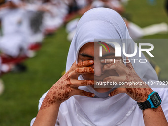 A girl is taking part in the 10th International Yoga Day Celebrations in Baramulla, Jammu and Kashmir, India, on June 21, 2024. Indian Prime...