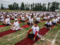 People are taking part in the 10th International Yoga Day Celebrations in Baramulla, Jammu and Kashmir, India, on June 21, 2024. Indian Prim...