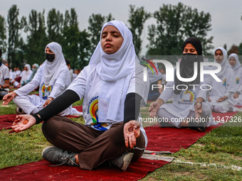 People are taking part in the 10th International Yoga Day Celebrations in Baramulla, Jammu and Kashmir, India, on June 21, 2024. Indian Prim...