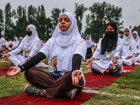 People are taking part in the 10th International Yoga Day Celebrations in Baramulla, Jammu and Kashmir, India, on June 21, 2024. Indian Prim...