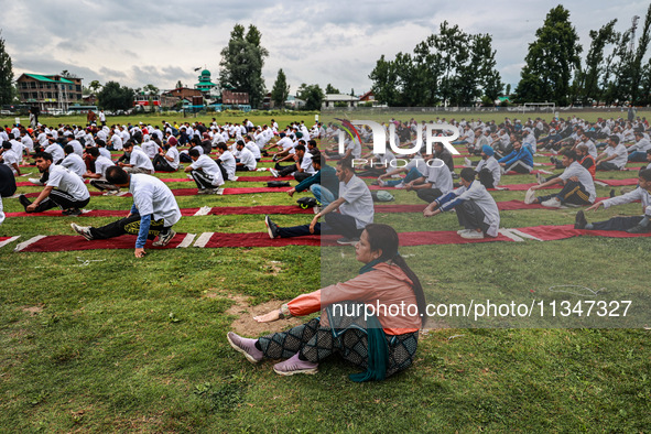 People are taking part in the 10th International Yoga Day Celebrations in Baramulla, Jammu and Kashmir, India, on June 21, 2024. Indian Prim...