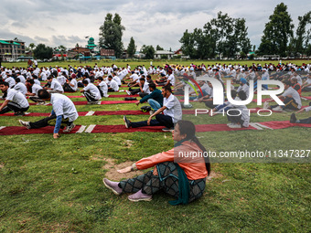 People are taking part in the 10th International Yoga Day Celebrations in Baramulla, Jammu and Kashmir, India, on June 21, 2024. Indian Prim...