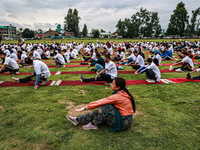 People are taking part in the 10th International Yoga Day Celebrations in Baramulla, Jammu and Kashmir, India, on June 21, 2024. Indian Prim...