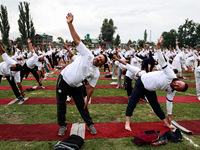 People are taking part in the 10th International Yoga Day Celebrations in Baramulla, Jammu and Kashmir, India, on June 21, 2024. Indian Prim...