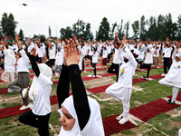 People are taking part in the 10th International Yoga Day Celebrations in Baramulla, Jammu and Kashmir, India, on June 21, 2024. Indian Prim...