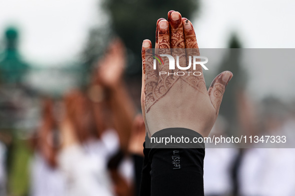 People are taking part in the 10th International Yoga Day Celebrations in Baramulla, Jammu and Kashmir, India, on June 21, 2024. Indian Prim...