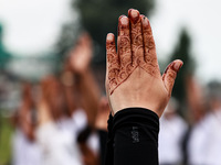 People are taking part in the 10th International Yoga Day Celebrations in Baramulla, Jammu and Kashmir, India, on June 21, 2024. Indian Prim...