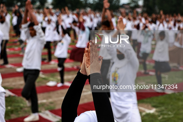 People are taking part in the 10th International Yoga Day Celebrations in Baramulla, Jammu and Kashmir, India, on June 21, 2024. Indian Prim...