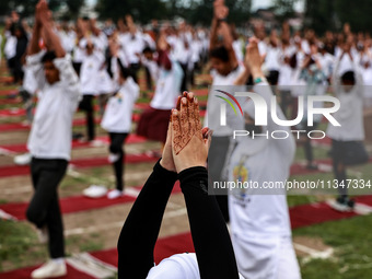 People are taking part in the 10th International Yoga Day Celebrations in Baramulla, Jammu and Kashmir, India, on June 21, 2024. Indian Prim...