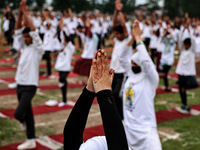 People are taking part in the 10th International Yoga Day Celebrations in Baramulla, Jammu and Kashmir, India, on June 21, 2024. Indian Prim...