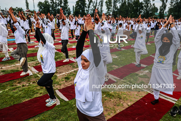 People are taking part in the 10th International Yoga Day Celebrations in Baramulla, Jammu and Kashmir, India, on June 21, 2024. Indian Prim...