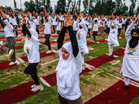 People are taking part in the 10th International Yoga Day Celebrations in Baramulla, Jammu and Kashmir, India, on June 21, 2024. Indian Prim...