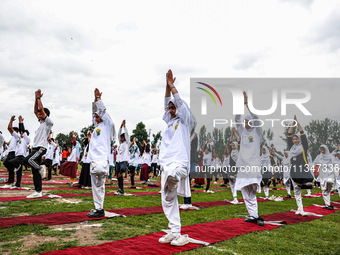 People are taking part in the 10th International Yoga Day Celebrations in Baramulla, Jammu and Kashmir, India, on June 21, 2024. Indian Prim...