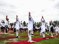 People are taking part in the 10th International Yoga Day Celebrations in Baramulla, Jammu and Kashmir, India, on June 21, 2024. Indian Prim...