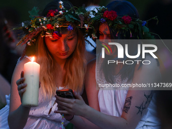 Participants celebrating the summer solstice gathered for the 'Kupala Night' by the Krakus Mound in Krakow, Poland on June 20th, 2024. The K...