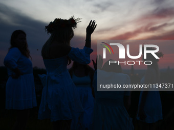 Participants celebrating the summer solstice gathered for the 'Kupala Night' by the Krakus Mound in Krakow, Poland on June 20th, 2024. The K...