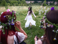 Participants celebrating the summer solstice gathered for the 'Kupala Night' by the Krakus Mound in Krakow, Poland on June 20th, 2024. The K...