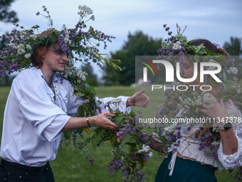 Participants celebrating the summer solstice gathered for the 'Kupala Night' by the Krakus Mound in Krakow, Poland on June 20th, 2024. The K...