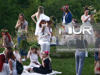 Participants celebrating the summer solstice gathered for the 'Kupala Night' by the Krakus Mound in Krakow, Poland on June 20th, 2024. The K...