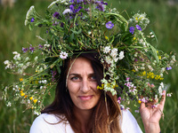 A girl celebrates the summer solstice during the 'Kupala Night' by the Krakus Mound in Krakow, Poland on June 20th, 2024. The Kupała Night i...