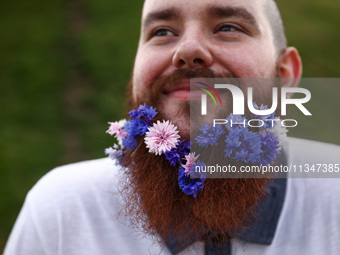 A participant celebrates the summer solstice and the 'Kupala Night' by the Krakus Mound in Krakow, Poland on June 20th, 2024. The Kupała Nig...