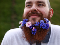 A participant celebrates the summer solstice and the 'Kupala Night' by the Krakus Mound in Krakow, Poland on June 20th, 2024. The Kupała Nig...