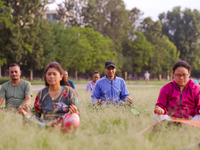 People are performing yoga on the occasion of International Yoga Day. (