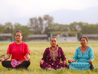 People are performing yoga on the occasion of International Yoga Day. (