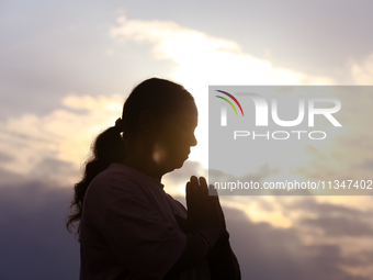 People are performing yoga on the occasion of International Yoga Day. (