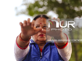 People are performing yoga on the occasion of International Yoga Day. (