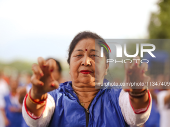 People are performing yoga on the occasion of International Yoga Day. (