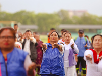 People are performing yoga on the occasion of International Yoga Day. (