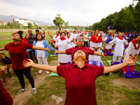 People are performing yoga on the occasion of International Yoga Day. (