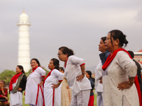 People are performing yoga on the occasion of International Yoga Day. (