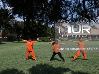 Nepalese people are practicing Yoga at an open ground in Bhaktapur, Nepal, on June 21, 2024, on the occasion of International Yoga Day. (