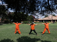 Nepalese people are practicing Yoga at an open ground in Bhaktapur, Nepal, on June 21, 2024, on the occasion of International Yoga Day. (