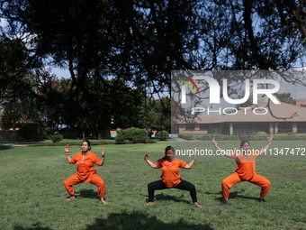 Nepalese people are practicing Yoga at an open ground in Bhaktapur, Nepal, on June 21, 2024, on the occasion of International Yoga Day. (