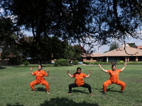 Nepalese people are practicing Yoga at an open ground in Bhaktapur, Nepal, on June 21, 2024, on the occasion of International Yoga Day. (