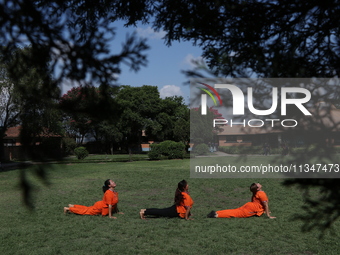 Nepalese people are practicing Yoga at an open ground in Bhaktapur, Nepal, on June 21, 2024, on the occasion of International Yoga Day. (